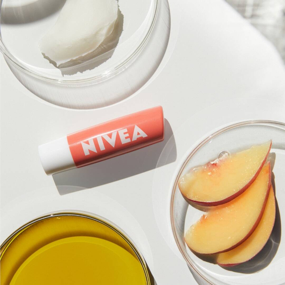 Nivea Pielęgnująca pomadka do ust Peach Shine 4.8g